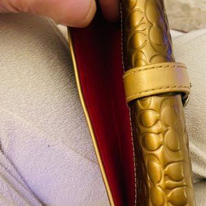 Coach Gold Leather Clutch